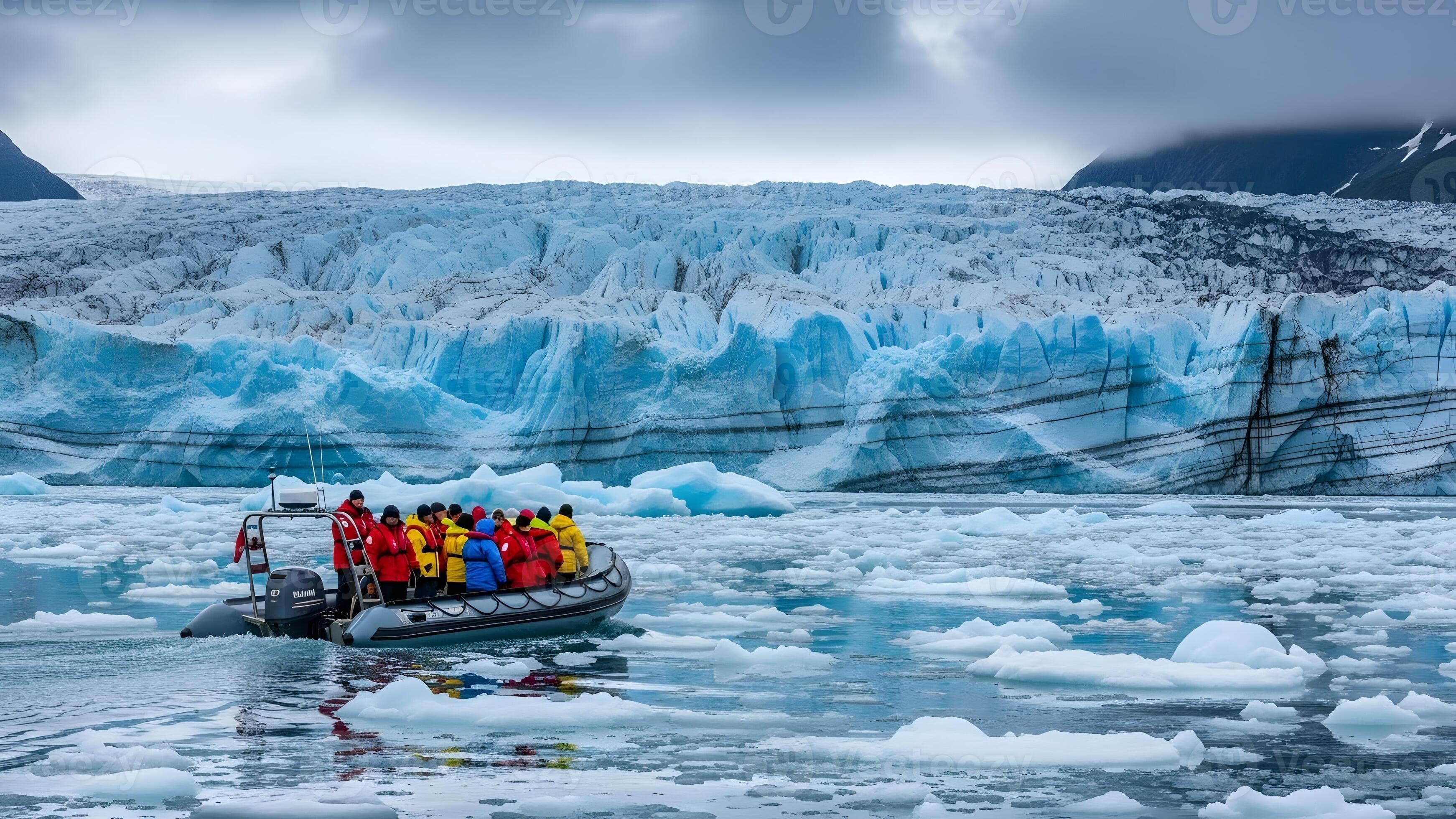 Tourists on inflatable boat explore icy waters near a massive glacier.