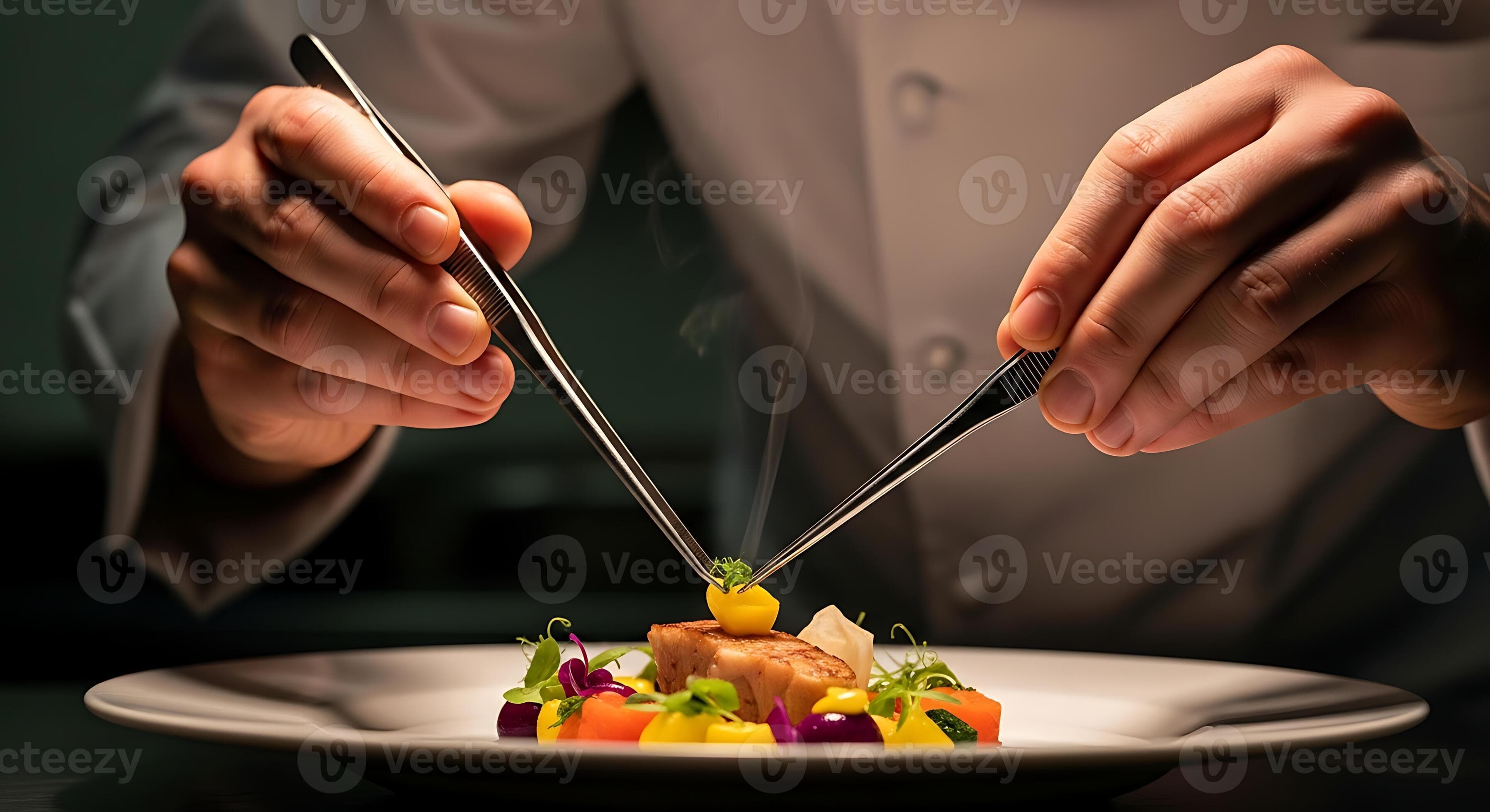 Professional chef carefully plating a gourmet meal with tweezers