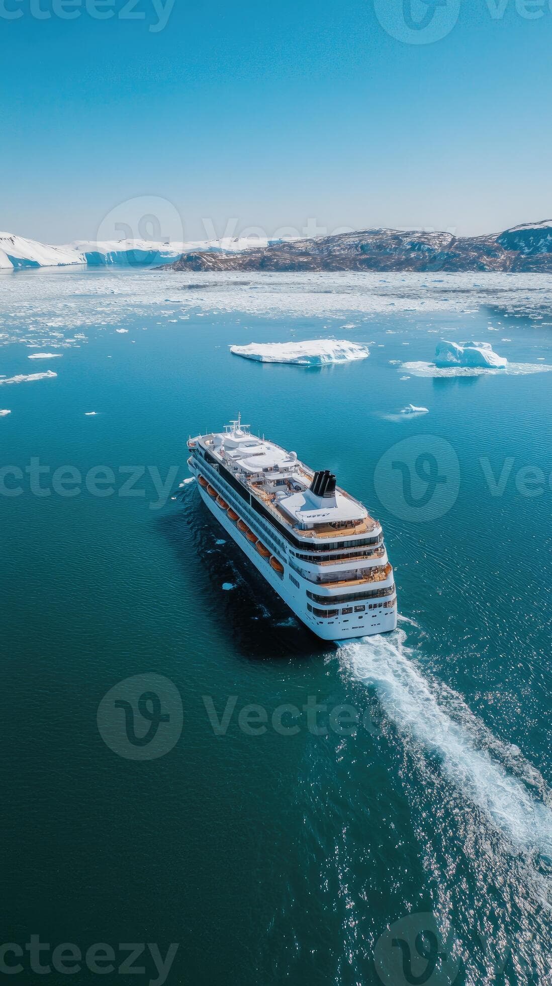 Cruise ship sailing through ice floes on a bright day vacation and travel concept