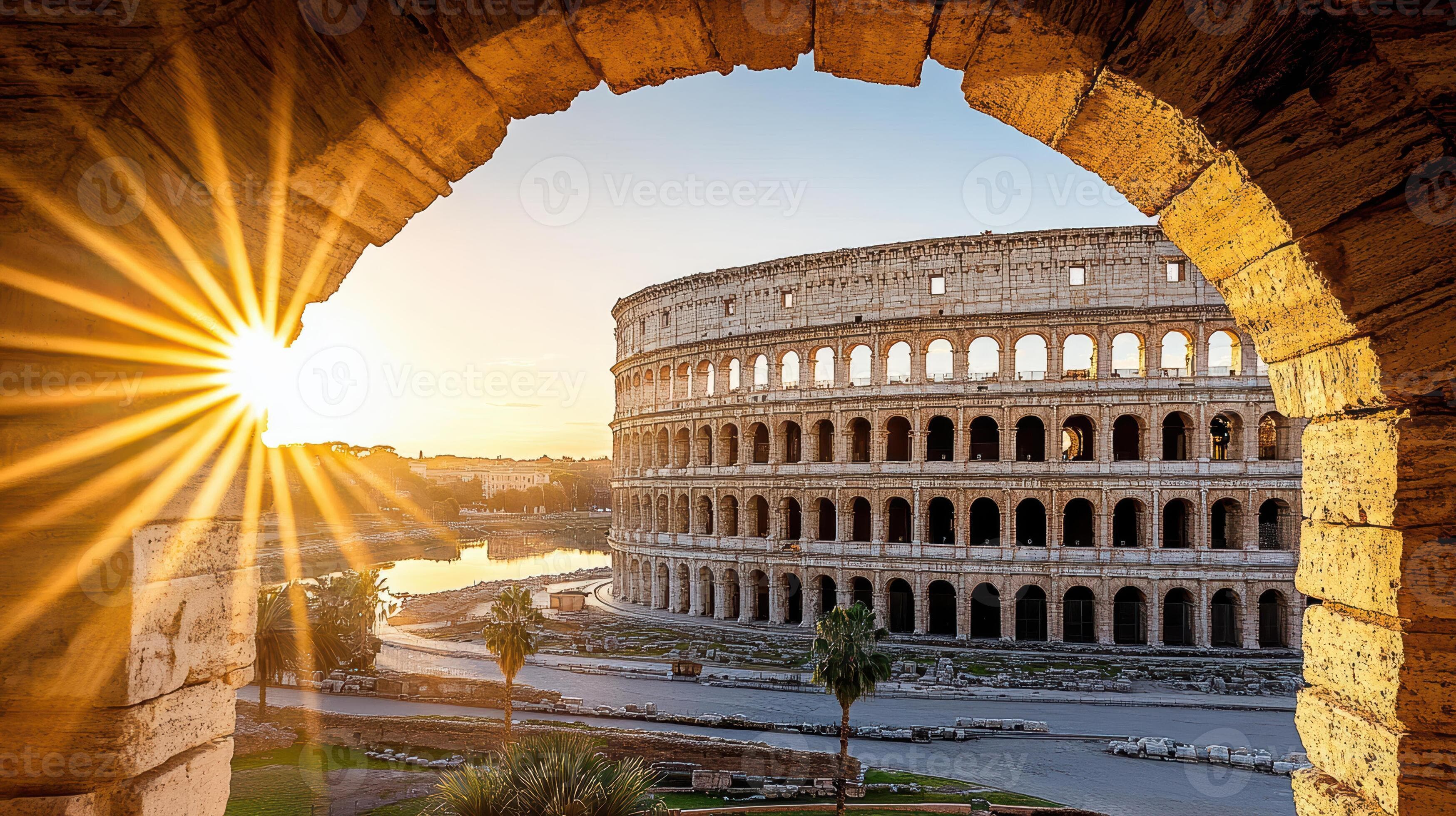 The sun shines through an archway in front of the colossion