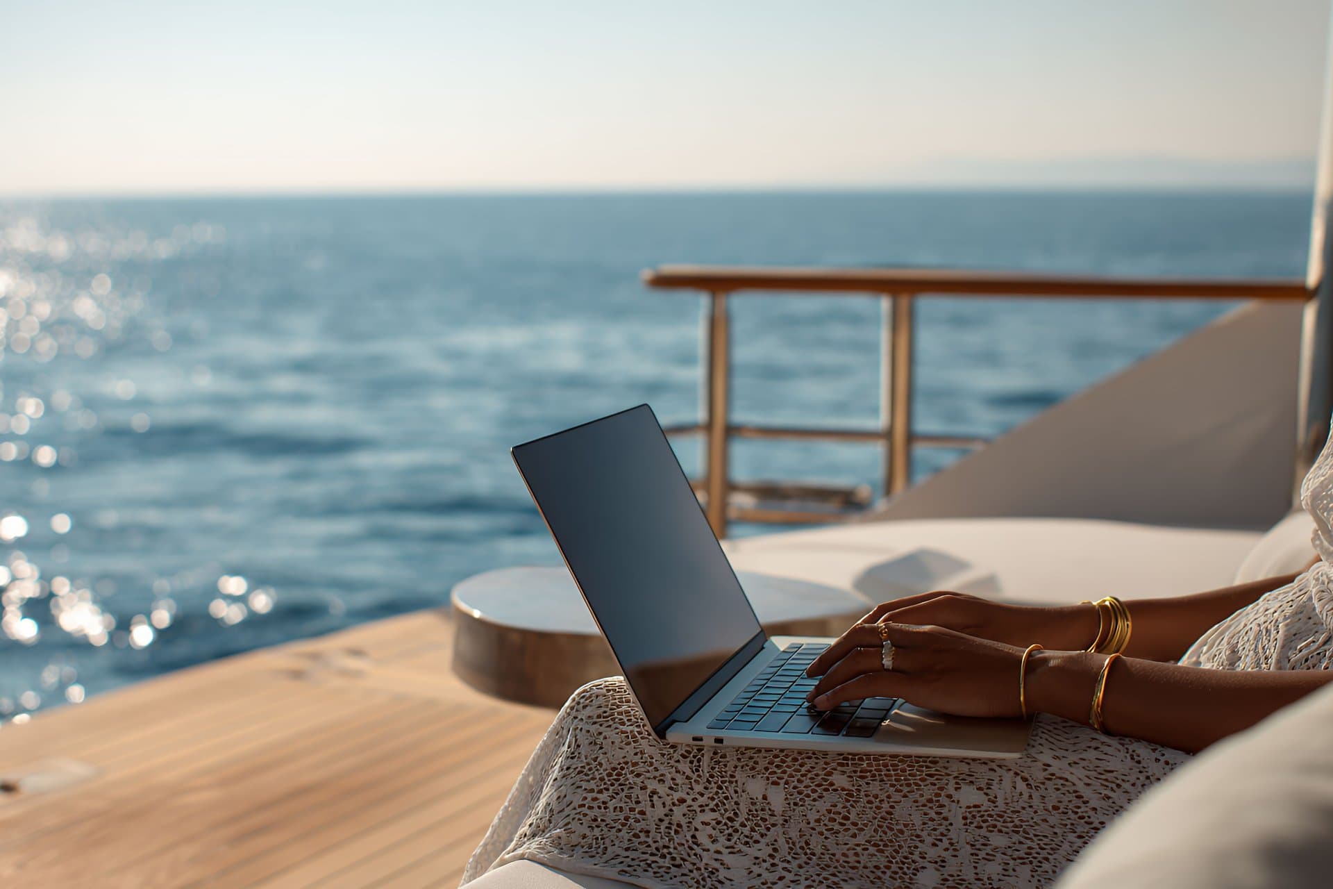 Working Remotely on a Yacht with Laptop Near Ocean View
