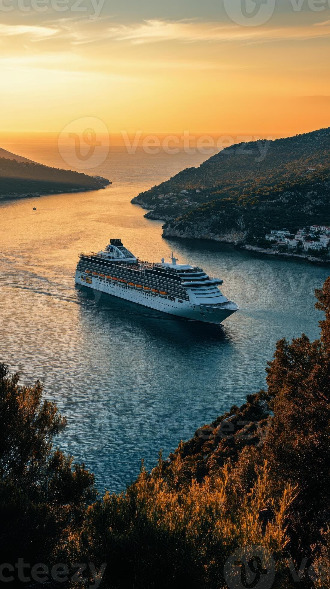 Cruise ship sailing through serene waters at sunset in a coastal landscape.